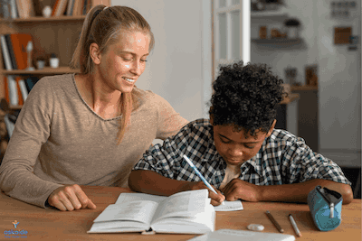 Teacher giving a lesson to a happy student learning, both smiling in Paris