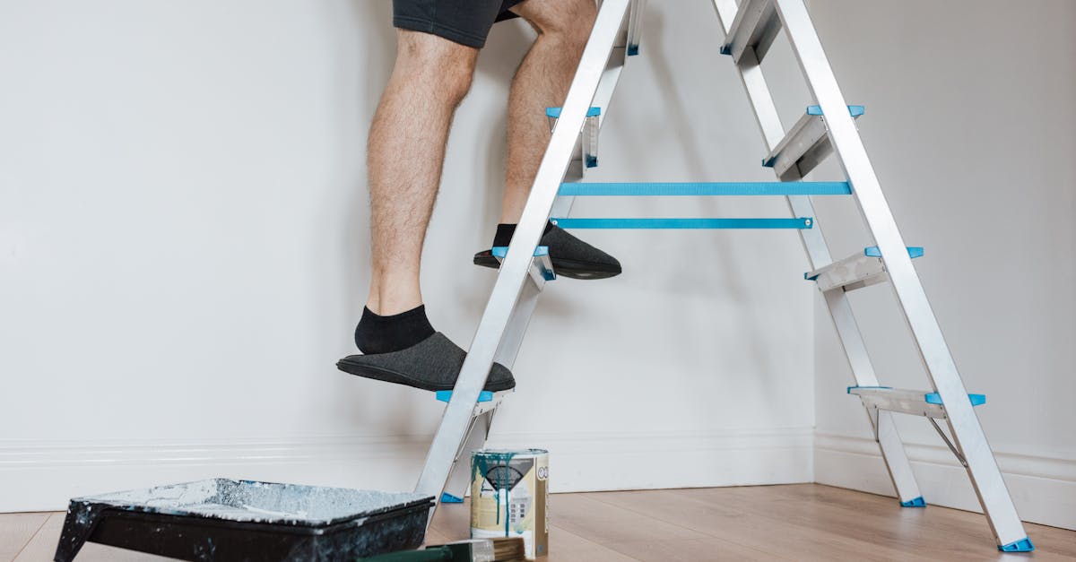 DIY workshop with professional tools, drill, screwdriver and hammer on a wooden workbench