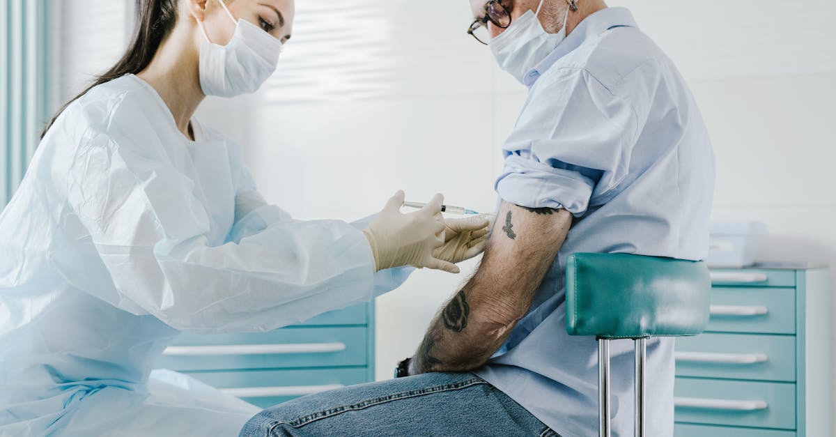 Woman with a dish towel wiping her forehead after cleaning the entire kitchen, showing fatigue and accomplishment.